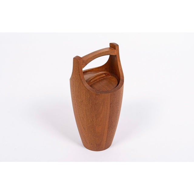 This vintage mid century Danish modern large teak ice bucket was designed by Jens H. Quistgaard for Dansk circa 1950. This...