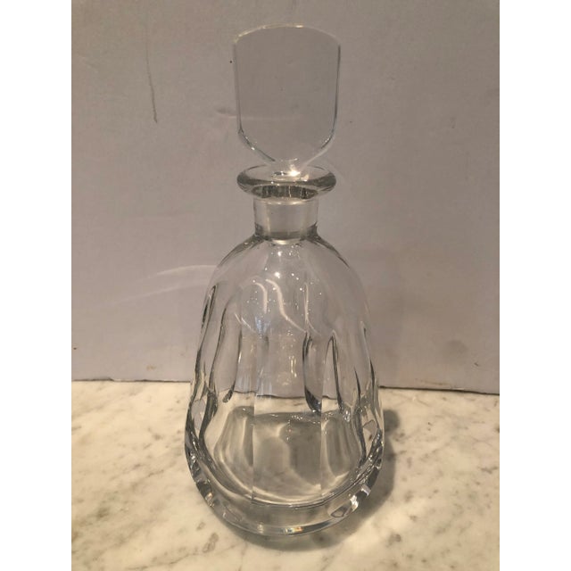 A vintage cut crystal decanter by Orrefors. Signed and numbered on bottom. A stylish addition to your bar.