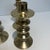 Candleholders with a gold finish with a spindle-shaped. Can hold taper candles. The largest size 10 1/2 inches high...