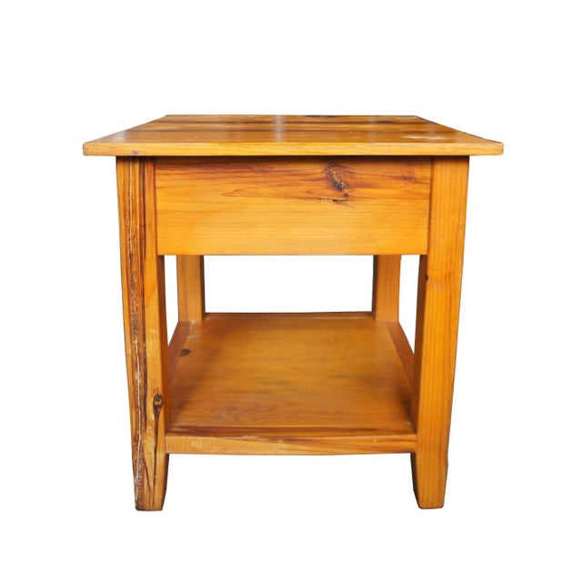 Arhaus country side table with shelf. Made from pine with a distressed finish. Made in the 2000s.