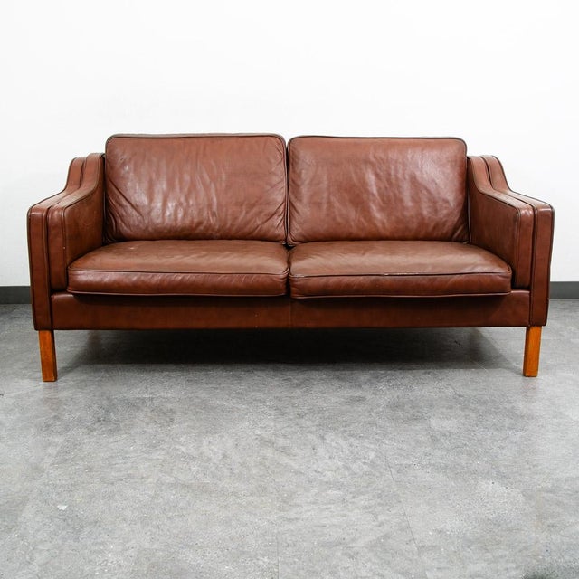 Brown leather 2 seater sofa imported directly from Denmark. Comes in the style of Borge Mogensen. Well made and...