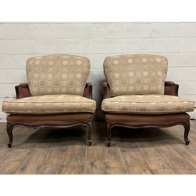 This is a gorgeous pair of vintage French Country Louis XV style Bergere chairs. Feature intricately carved frames, large,...