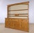 A beautiful oversized antique English pine dresser with wonderful warmth, character, and an impressive 87-inch width....