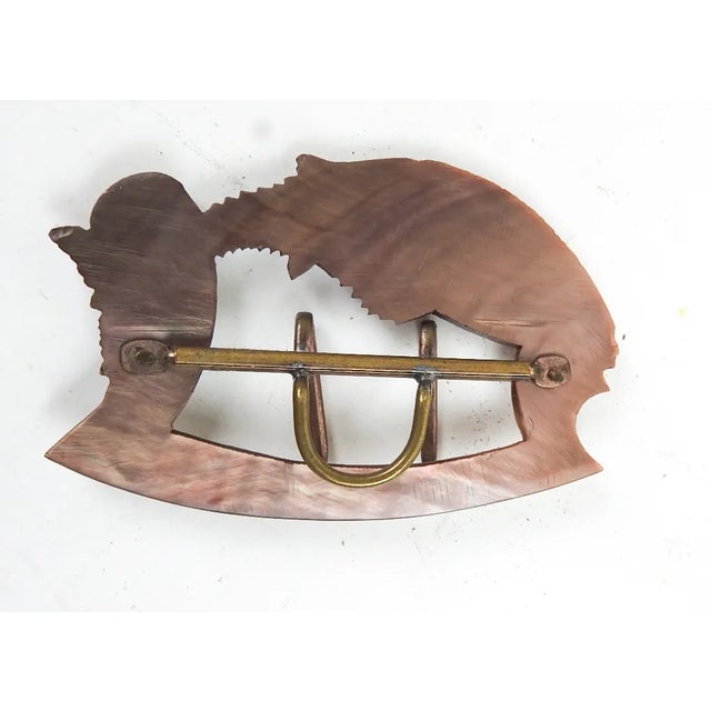 Antique circa 1900 mother of pearl carved fish sash buckle. Fits 1.5" sash, brass hardware.
