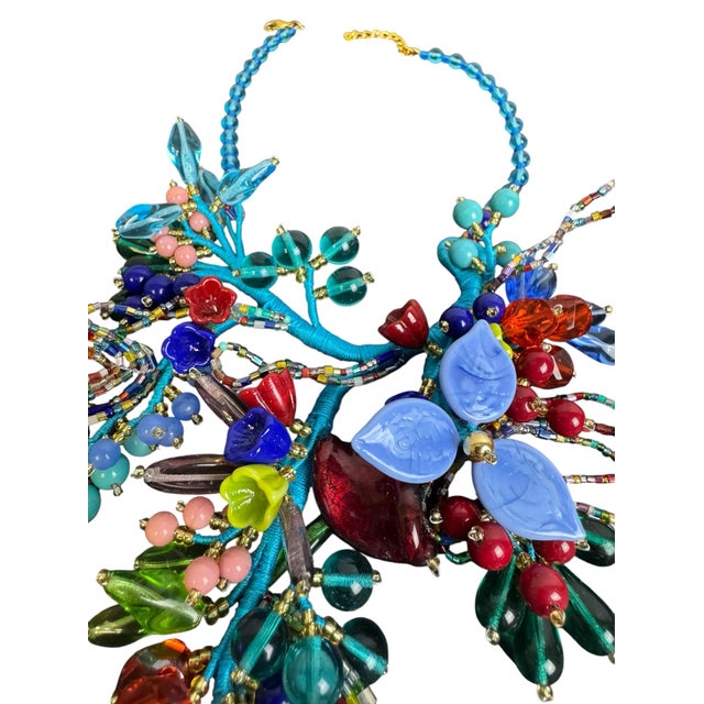 A wearable garden of gorgeous color. This elaborate 14-16” Murano glass eye-catching statement necklace features an...
