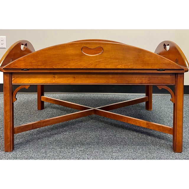 Larger scale Chippendale style butler’s tray coffee table. Solid cherry with a yew wood paneled top. Nicely molded kegs...