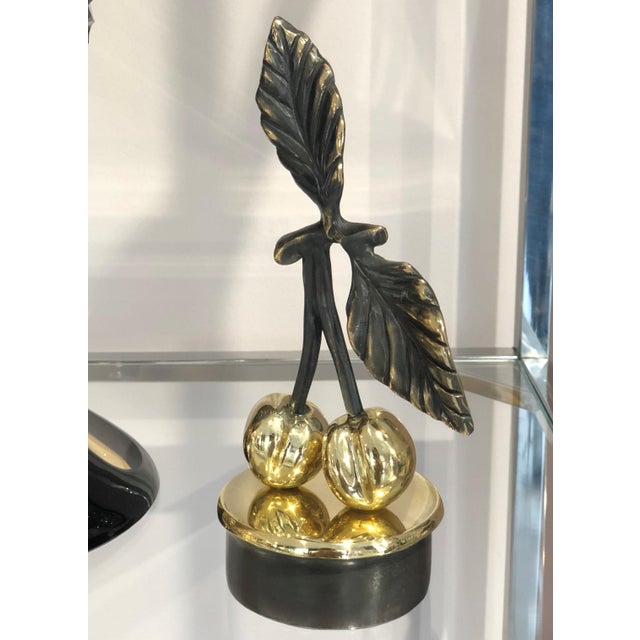 "Cherry" — from the *Fruits* series A contemporary still-life bronze of a pair of cherries on a shared stem, mounted on a...