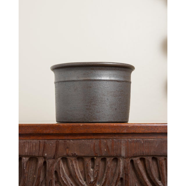 Dimensions: 8.75" D × 5.75" H Interior Opening: 7.5" D Vintage California modern stoneware planter with a rich variegated...