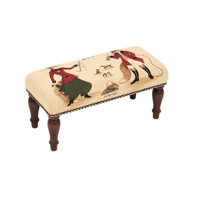 Meticulously handcrafted in the United Kingdom, this upholstered stool boasts classic studding and hand-polished solid...