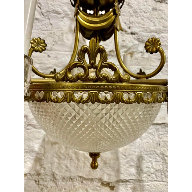 Width : 18” diameter of the glass shade Height: 17” 13” chain 29” wire Elevate your home with the timeless grandeur of...