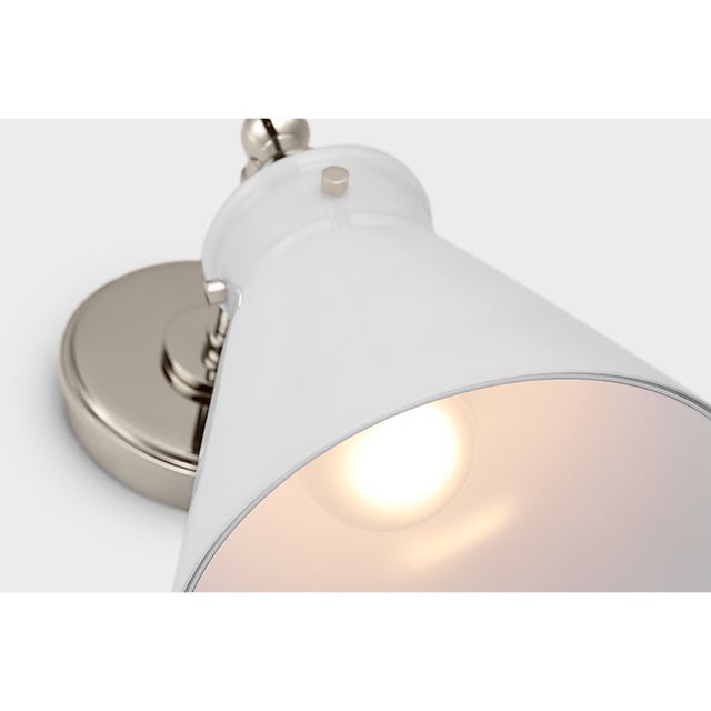 Description: Embodying industrial minimalism with a touch of elegance, the Chapman & Myers Parkington collection merges...