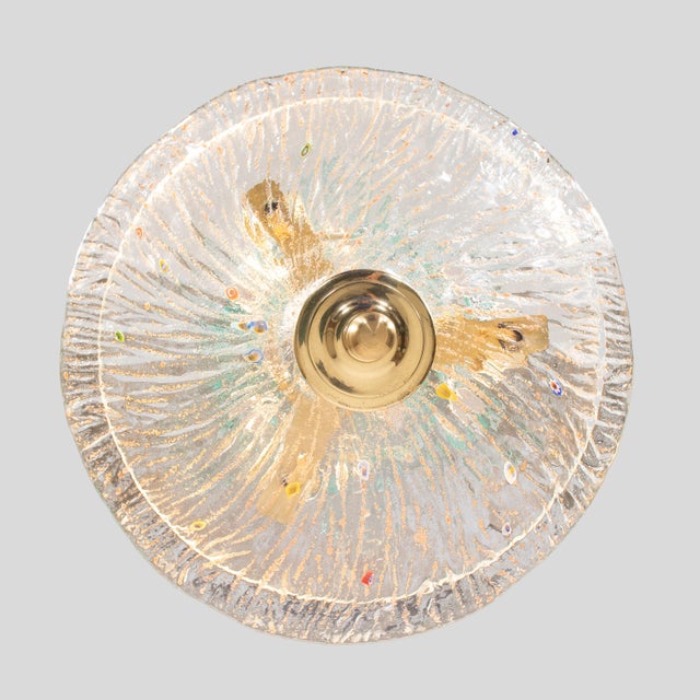 Mid‑Century Italian Murano glass pendant chandelier, the three‑light interior encased by a flared, ribbed bowl richly...