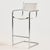 An Italian bar stool from the 1980s with a Bauhaus-style chrome tubular frame. with some scratches, wear and rust on the...