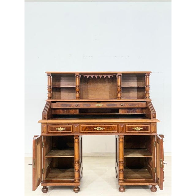 Stylish Biedermeier desk from around 1880. The piece is in well-maintained, good used condition. A characteristic feature...