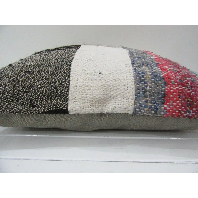 This is a pillow cover made from a vintage kilim rug. The piece was properly washed and ready to use. Pillow inserts not...