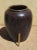 Antique South East Asian Wine Jar in a Dark brown glaze with hints of blue. The jar measures approximately 30 inches tall...