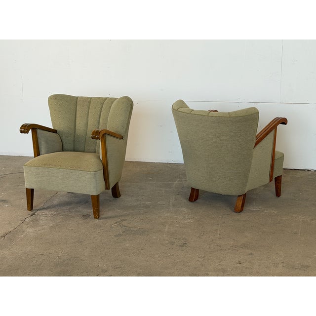 This pair of lounge chairs was produced by an Danish cabinetmaker during the 1940s. Each chair is built on a solid beech...