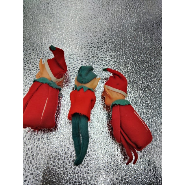 Three knee hugger pixie elves. They are in good condition The tall one is a about 6" and the small one is about 5".