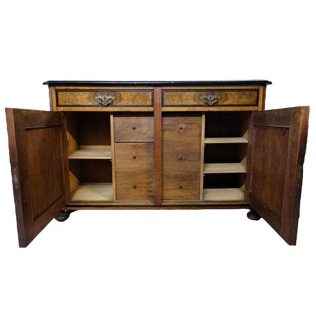 Light mahogany sideboard with 2 doors and 2 drawers and round legs from around the 1920s. Measurements in cm: H:91 W:142 D:52