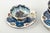 Set of four teacups with matching saucers, glazed ceramics hand-decorated with polychrome floral motifs in blue, brown,...