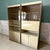 Elevate a living space with this exceptional three-section freestanding wall unit, offering a sophisticated blend of mid-...
