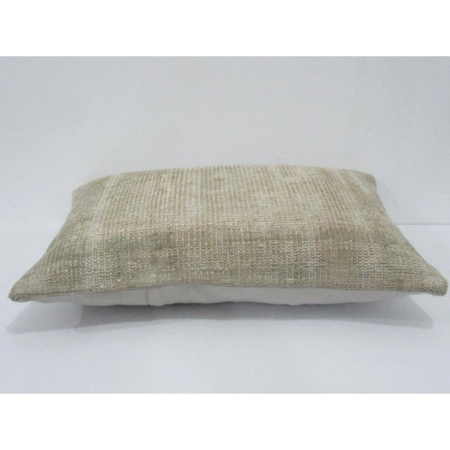 Decorative pillow cover made from a vintage Turkish handknotted rug. Backed with good quality cotton fabric. Pillow...