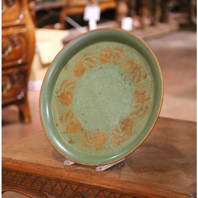 19th Century French Hand-Painted Green Tole Tray with Gilt Floral Decor. Crafted in France circa 1880, this charming...