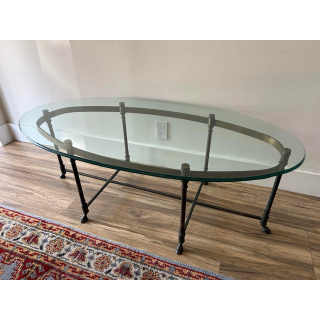 Vintage antiqued brass oval coffee table. Lovely, oxidized brass patina gives this piece a more rustic, informal vibe than...