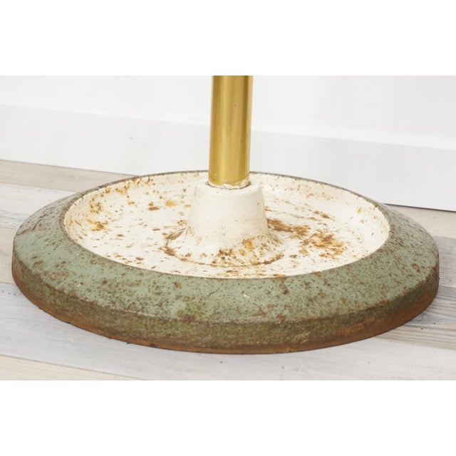 Coat rack from the 50s-60s made of brass, metal and cast iron base.