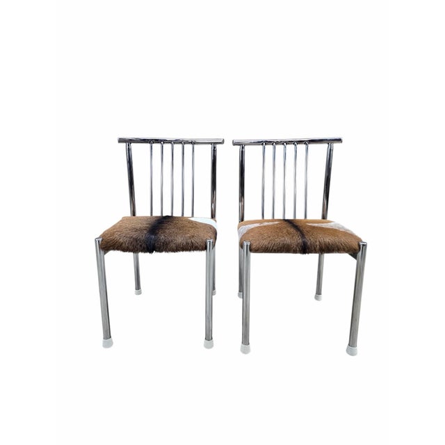 Mid-Century Modern B. Brody Chrome Spindle Back Side Chairs Newly Reupholstered in Cowhide – Pair Pair of mid-century...