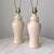 A pair of vintage Hollywood Regency style ginger jar lamps with original lampshade harps and finials. Measurements: 5.5 ʺL...