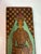 Pyrography on wood, freehand, depicting a woman in traditional late-Ottoman dress. Veiled beneath a crimson fez, robe and...