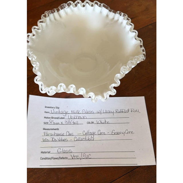 Vintage Milk glass bowl features a striking Clear ruffled rim that adds a touch of elegance to any tabletop. The classic...