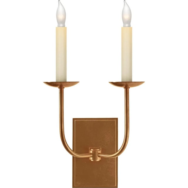 TT Double Sconce in Hand-Rubbed Antique Brass Designer: Chapman & Myers Height: 18" Extension: 7" Backplate: 4" x 6"...