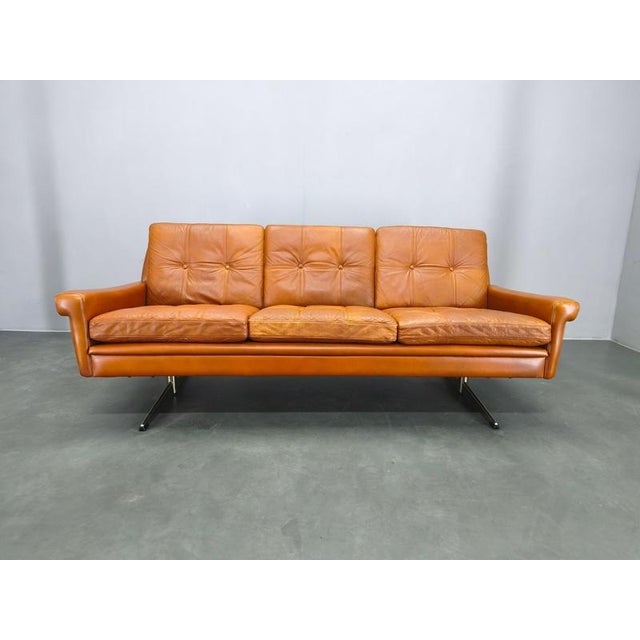 Exceptional mid century Danish leather sofa designed by Svend Skipper in the 1960s. This elegant three-seater features...