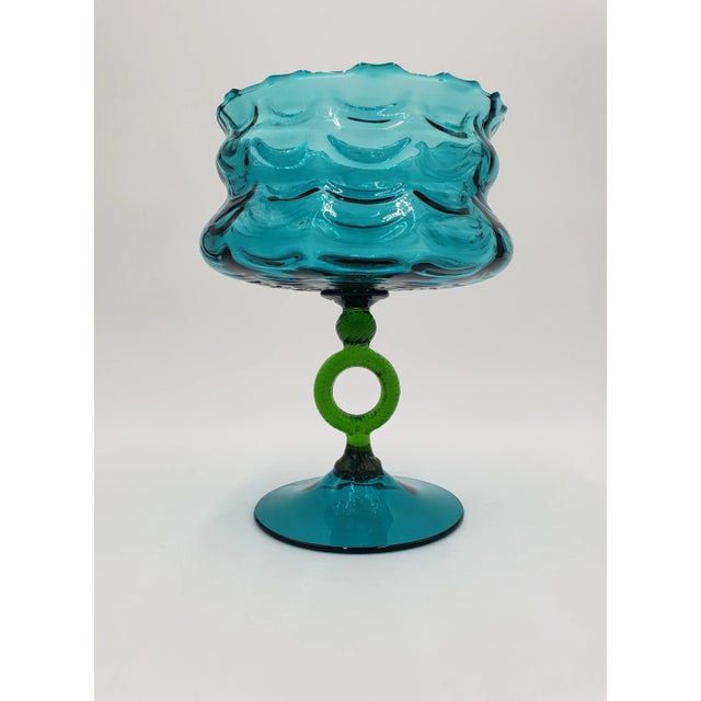 This stunning Mid-Century Modern Empoli pedestal vase was made in Italy in the 1960s. The vase has a draped swag pattern...