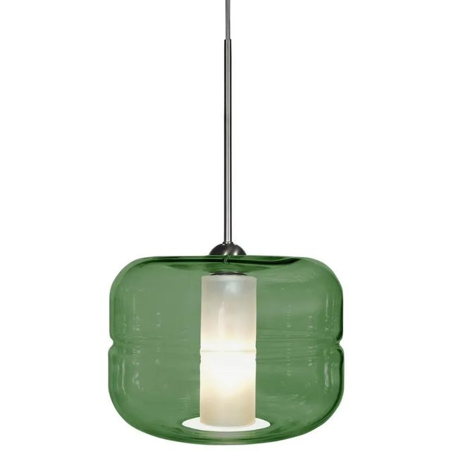 Clean, crisp lines make this glass fixture perfect for a modern interior. The exterior is transparent and the interior...