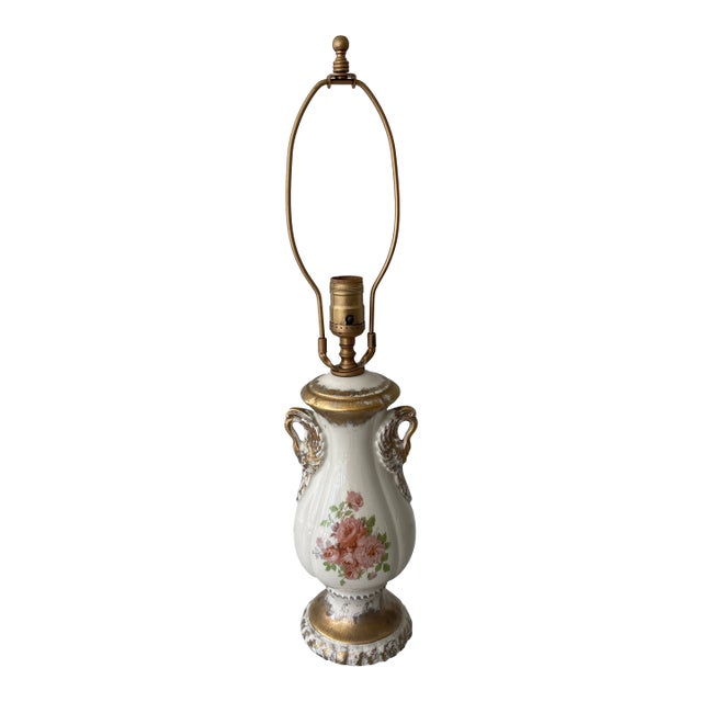 This vintage lamp will grace any room with its by gone charm. Exquisite detailing with double arms and gold flourishes....