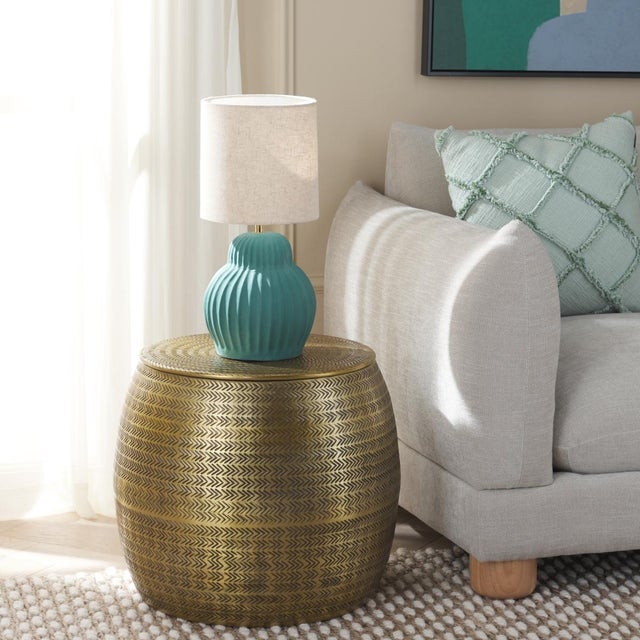 Glam up your space with our sleek and beautifully detailed Apoline side table with storage. With a gleaming finish, rich...
