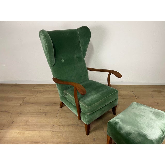 Armchair with wooden footrest and green velvet upholstery, attributed to Paolo Buffa, made in Italy in the 1950s. The set...