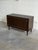 Beautiful vintage Danish modern cabinet crafted in stained oak, featuring elegant sliding doors, tapered legs, and refined...