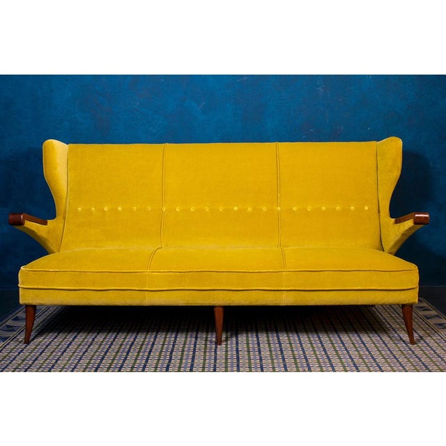 Amazing Mid-Century Italian Canapè or Sofa with wood legs and arms . Acid green new upholstery in perfect condition. This...
