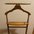 Beautiful mid-century modern wooden suit valet stand by Butler Specialty Company (Model 973). Features a contoured coat...