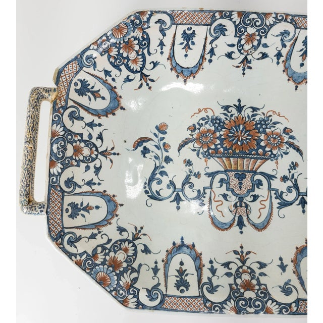 We are selling this great and exceptionally rare large Platter. This French Faience platter is decorated in red and blue...