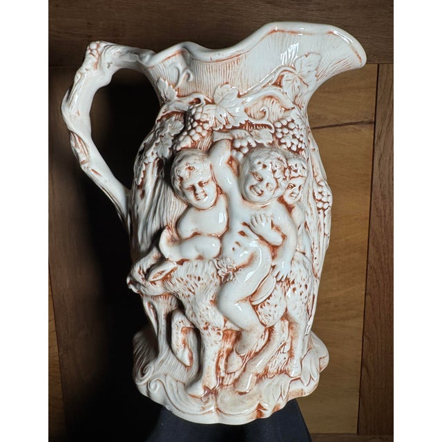 American 1970s Handmade Majolica-Style Bacchus Pitcher With Putti Relief, Dated 1976 For Sale - Image 3 of 4