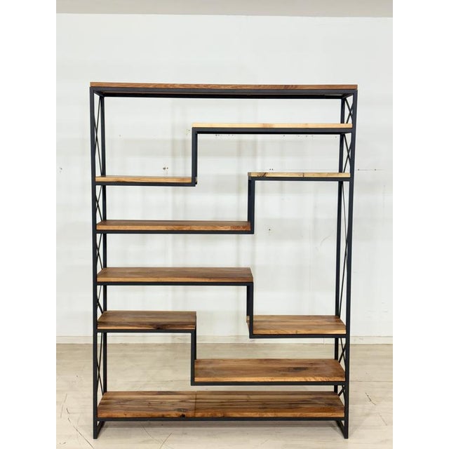 For sale is an exceptional shelving unit crafted from solid walnut, distinguished by its sculptural design. The...