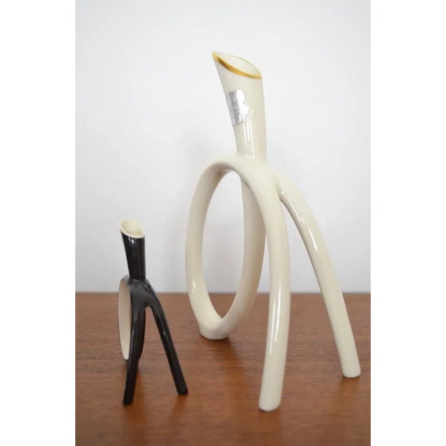 Vases duo from the 1950s Midcentury. These two loop vases were produced by the Porcelain Manufaktur Lindner. The small...