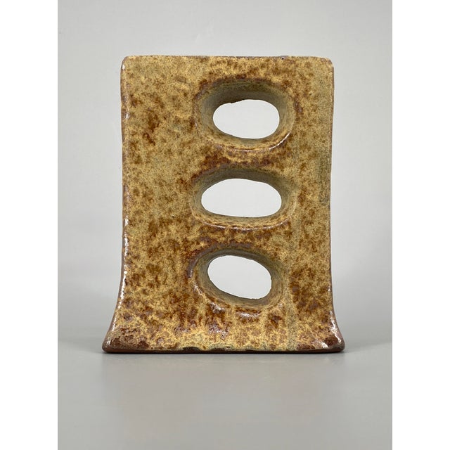 A vase * A ceramic vase * with Fat Lava glaze * The glaze has a silvery sheen in places, see photos * Color: Beige/Cream *...