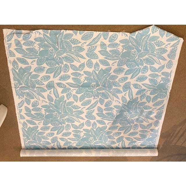 China Seas' 54" wide cotton / linen blend fabric features a modern tropical leave print in aqua on a cream ground....