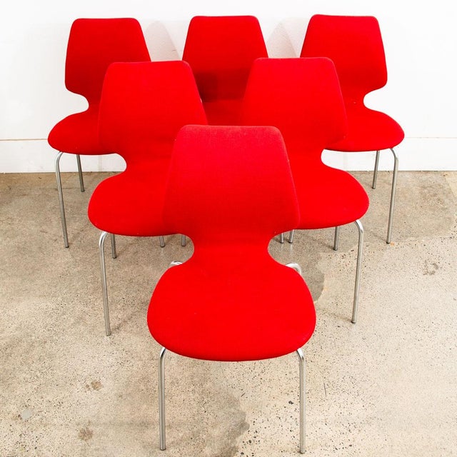 Set of 6 Danish modern dining chairs in red tweed. Each chair sits on a chrome metal frame. Classic Danish style....